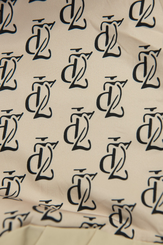 Prodloužená parka s potiskem v kapuci světle béžová