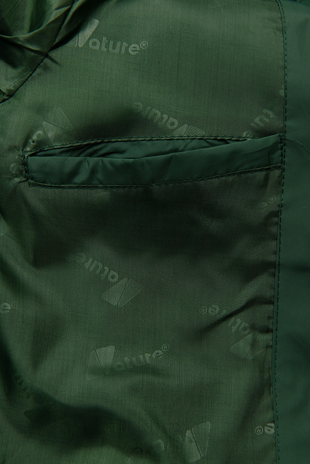 Přechodná bunda v prodlouženém střihu zelená